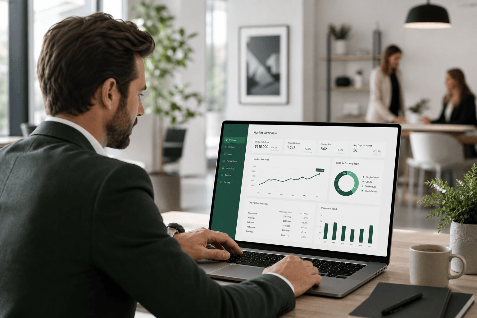 Agent reviewing Renovora market analytics on a laptop